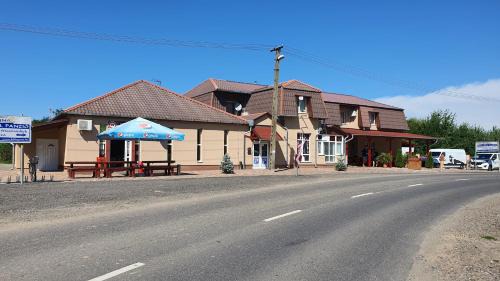 Dombrad Bed & Breakfast | Discover Kék Lagúna Panzió: Oceanfront Comfort Awaits