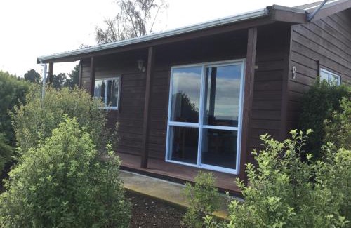 Kairaki Beach Villa | Family-Friendly Kairaki Beach Motor Camp with Ocean Views