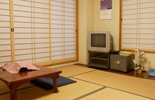 Koshigoe Hotel | Discover Kakiya Ryokan: Oceanfront Retreat with Hot Tub