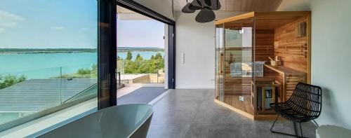 Lobstaedt Villa | Relaxing Retreat at KANANI am Hainer See with Oceanfront Views