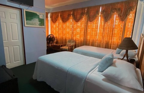 Georgetown Hotel | Discover Kanuku Suites: Family-Friendly with Dining Options