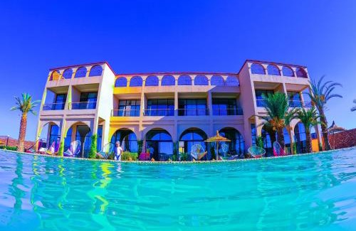 Tarmigt Hotel | Experience Kasbah Yu Palace: Oceanfront Oasis with Pool