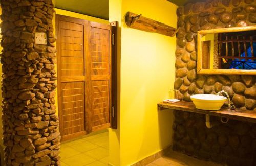 Kibale Cabin | Discover Kibale Forest Camp: Family-Friendly Retreat