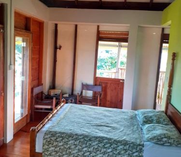Calibishie House | Explore Kiki's Nature Cabin with Oceanfront Views