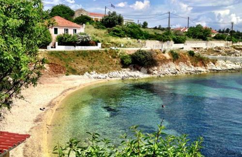 Matsoukata Apartment | Relax at Kiki Studios: Oceanfront Bliss with Pool Access