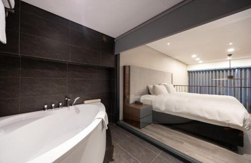 Tay Ho Apartment | Elegant Duplex Apartment at PentStudio with Bridge Views