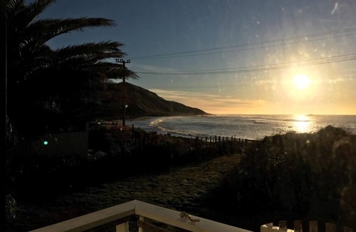 Pongaroa Cabin | Beachfront Kiwi Bach with Pool and Ocean Views