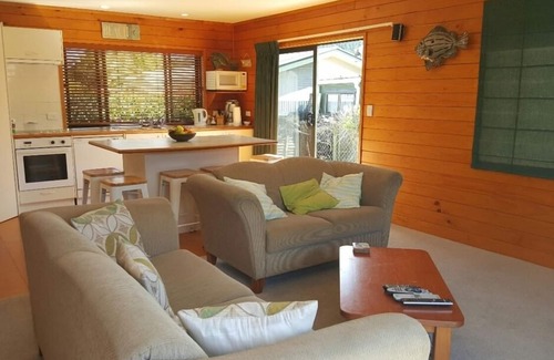 Whangamata House | Guest Rated 9.8: Kiwi Bach with Ocean View & Pool