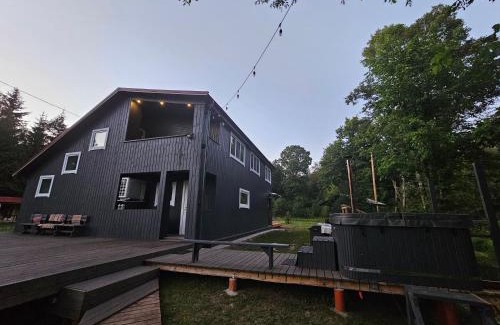Idena House | Experience KLĀNU MĀJA: Oceanfront Haven with Pool & Hot Tub