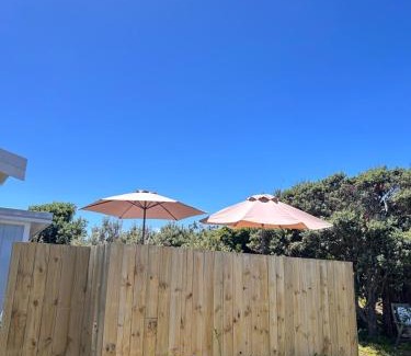 Otaki Beach House | Top-Rated Kowhai Landing Beach Cabin with Hot Tub Access
