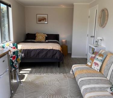 Otaki Beach House | Top-Rated Kowhai Landing Beach Cabin with Hot Tub Access