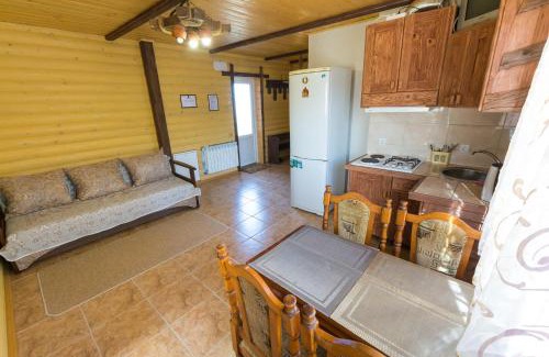 Skhidnytsya House | Budget-Friendly Kozatsky Dvorik with Kitchen Amenities
