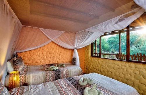 Thorny Bush Game Reserve Cabin | Relax at Kubu Safari Lodge: Oceanfront Haven with Spa