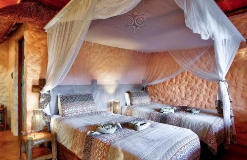 Thorny Bush Game Reserve Cabin | Relax at Kubu Safari Lodge: Oceanfront Haven with Spa