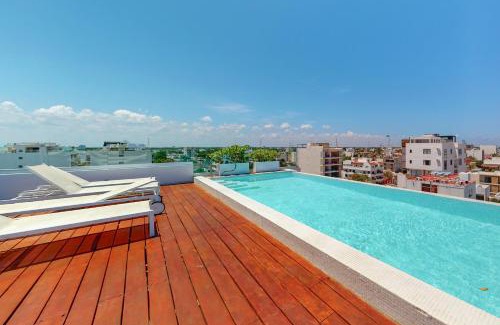 Zazil-ha Apartment | Discover Kumaru 502: Family-Friendly with Pool Access