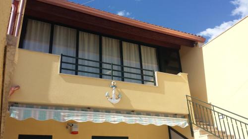 Casuzze Apartment | Oceanfront Escape at L'Ancora Azzurra - Rated 9.7/10