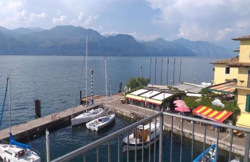 Brenzone sul Garda Apartment | Oceanfront Retreat at l'angolo sul porto - 4-Star Stay
