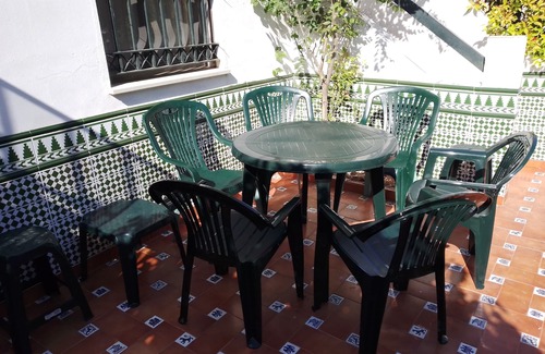 Islantilla Ski Chalet | Discover La Antilla: Garden Retreat with Parking for 8