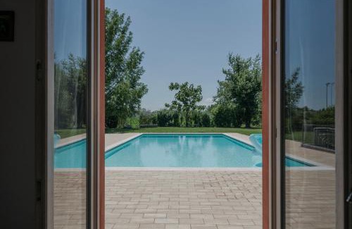Pozzolengo Apartment | La Casina Apartment: Garden Oasis with Pool & Ocean Views