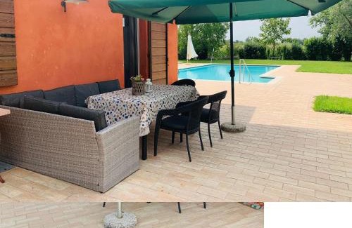 Pozzolengo Apartment | La Casina Apartment: Garden Oasis with Pool & Ocean Views