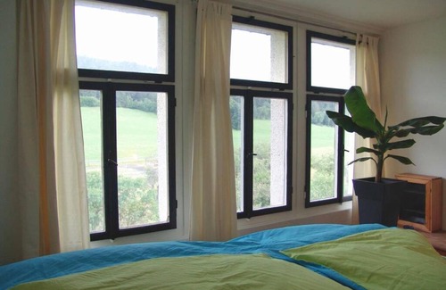 Les Pommerates Apartment | Explore La Colonie: A Historic Getaway with Family Amenities