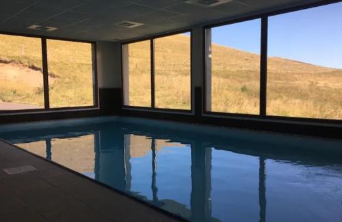 Besse-et-Saint-Anastaise Apartment | Discover La forêt des Marmottes: Guest Rated 9.4 with Pool