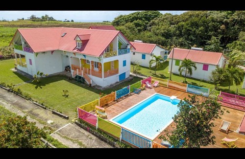Capesterre-de-Marie-Galante House | Discover La Tourterelle Rose: Pet-Friendly Retreat with Pool