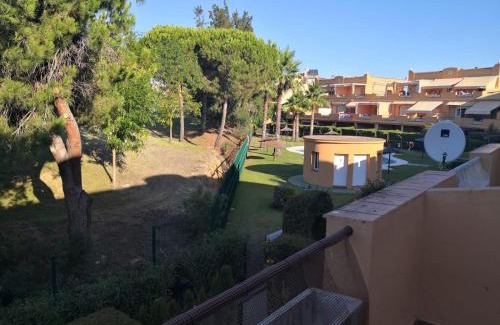 Islantilla Apartment | Discover La Hacienda: Pet-Friendly Retreat with Pool Access