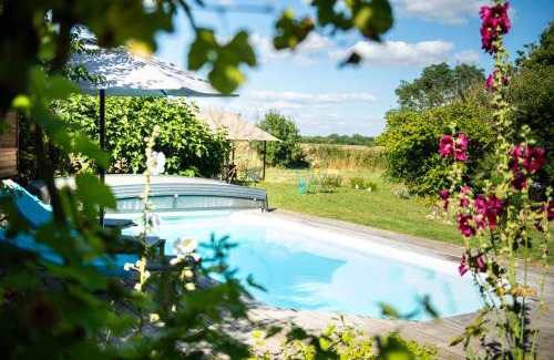 Le Gue-d'Allere Cabin | Experience the African Lodge with Pool & Ocean Views