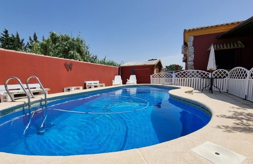 Chiclana de la Frontera Ski Chalet | Indulge at La Kasuka: Villa with Pool & Pet-Friendly Amenities