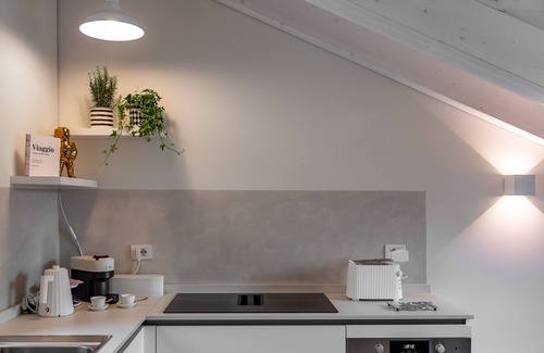 Chinatown Apartment | Elegant La Mansarda di Sarpi Apartment in Central Milan