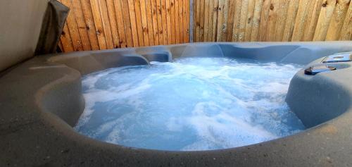 Tunstead House | Pet-Friendly Laburnum Holiday Cottage with Hot Tub & Amenities