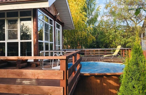 Nizhny Novgorod House | Relax at Lada Holiday Home with Pool & Hot Tub Amenities