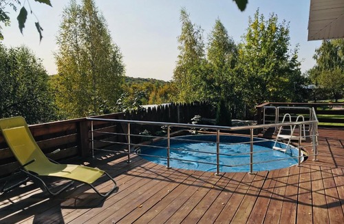 Nizhny Novgorod House | Relax at Lada Holiday Home with Pool & Hot Tub Amenities