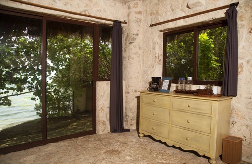 Mario Villanueva Madrid Cabin | Cozy Lagoon Front Suite with Bikes, Kayaks & Spa Access