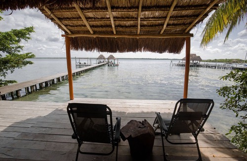 Mario Villanueva Madrid Cabin | Cozy Lagoon Front Suite with Bikes, Kayaks & Spa Access