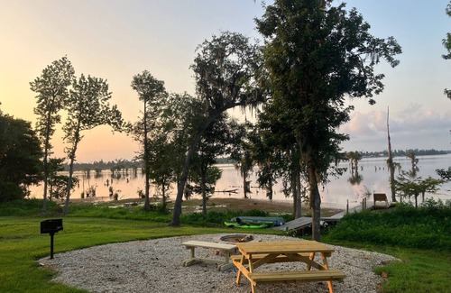 Southport Cottage | Lake Front Rental in Panama City with Kayak, EV Charger, & Dock - Dog Friendly