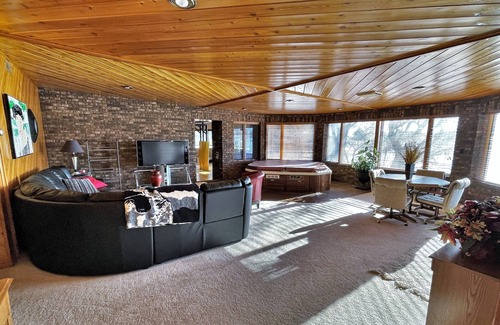 Mitchell House | Lake House on Lake Mitchell with a gymnasium and indoor hotub