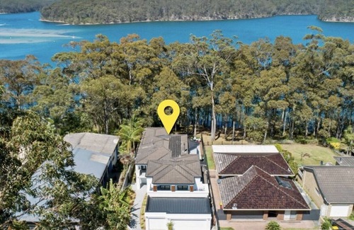 Kings Point House | Lake House Retreat with Pool, Theatre Room & Ocean Views