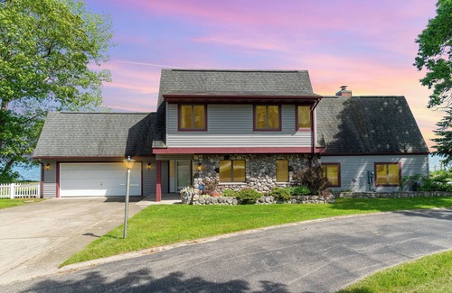 Au Gres House | Lake Huron Beach Retreat has 3 bedrooms and 2 full baths with a sandy beach!