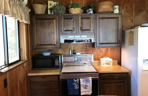 Pentwater Cottage | Inviting Lake Michigan Front Retreat with Private Beach Access
