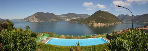 Sulzano Apartment | Lake View 34: Oceanfront Escape with Pool & High Ratings