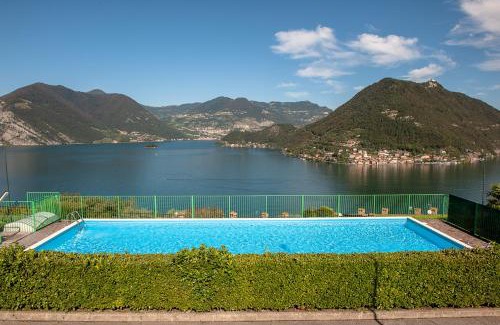 Sulzano Apartment | Lake View 34: Oceanfront Escape with Pool & High Ratings