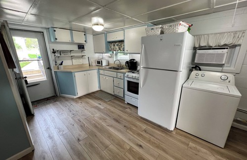 Gladwin Cottage | Scenic Lakefront Cottage on Wiggins Lake with Pool & Spa