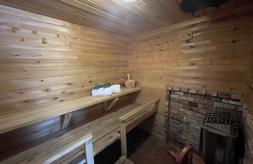 Gwinn Cottage | Cozy Cedar Cottage: Lakefront Retreat with Spa & Firepit