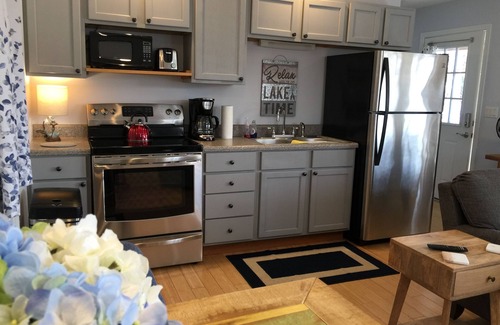 Jamestown Cabin | Pet-Friendly Lakefront Retreat with Hot Tub & Private Dock