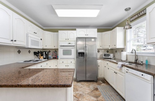 New London House | Lakefront Oasis with Putting Green, Dock & Game Room Fun