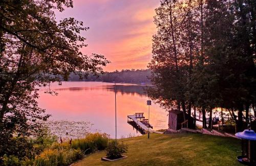 Curtis Township House | Lakefront Retreat with Dock, Kayaks & Cozy Fire Pit