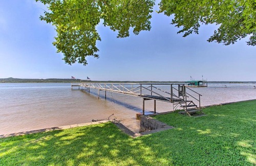 Graford House | Lakefront Retreat: Dock, Bar Hut & Cozy Fireplace Escape!