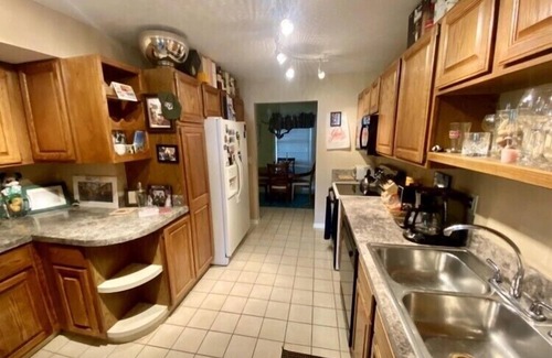 Haslett Condo | Scenic Lakefront Retreat with Spa and Family-Friendly Amenities